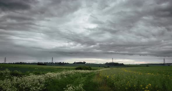Moody Storm Clouds Over Agriculture Field In Summer