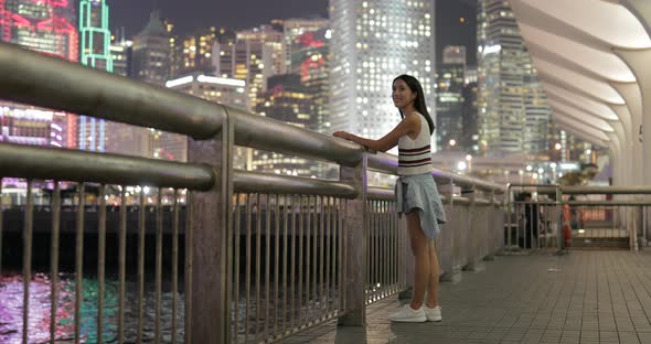 Woman visit Hong Kong and looking far away in Hong Kong alt