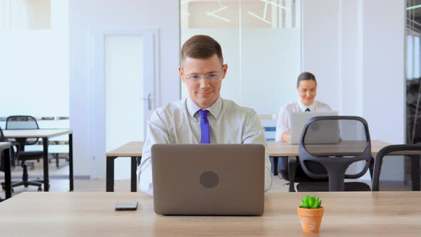 Portrait Businessman Using Laptop Showing Sign Thumb Up at Workplace alt