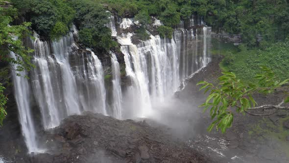 Kalandula Falls spraying water over bushes  alt