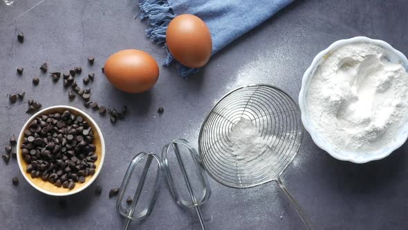 Baking Ingredients on a Black Background Top View alt