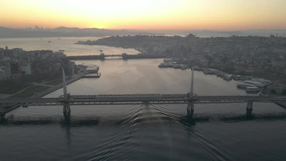 Aerial view boat crossing under bridge at golden horn of istanbul.