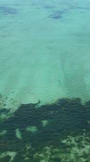 Boat Boats in the Ocean Near the Coast of Zanzibar Tanzania Slow Motion Vertical Video alt