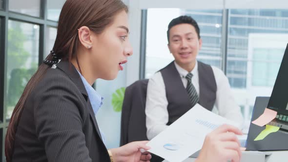Asian young business man and woman people group having a discussion meeting in office workplace. alt