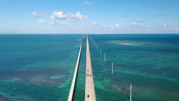 Vehicles Driving On Overseas Highway Through The Florida Keys To Key West In USA. - aerial alt