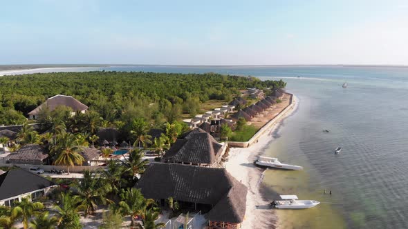 Paradise Coast Resort with Palm Trees and Hotels By Ocean Zanzibar Aerial View alt