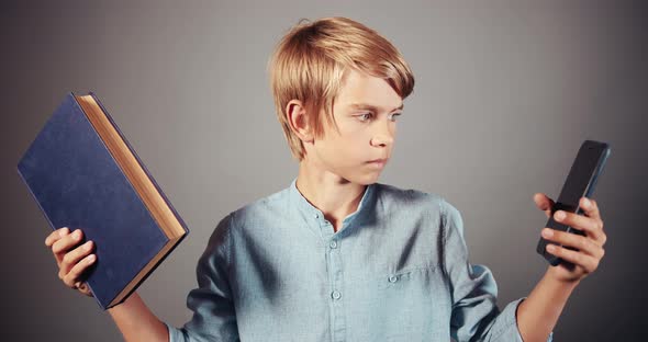 Boy Choosing Book and Smartphone Isolated