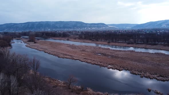 Aerial view of the channels of the Volga river in early spring.