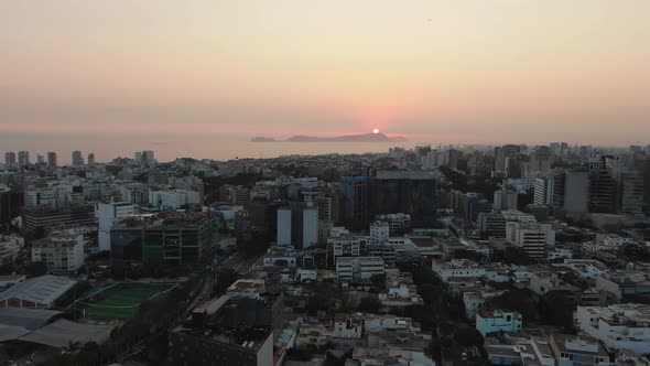 4k, aerial, dolly in, 30 fps, Video looking over the crowded Lima metropolis in Peru situated on the alt