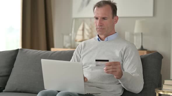 Attractive Businessman Successful at Online Payment on Smartphone alt