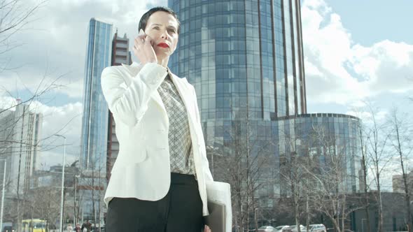 Successful Businesswoman Taking Phone alt