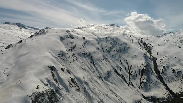 Aerial video of the Swiss Alps from Andermatt, Switzerland during winter (2) alt