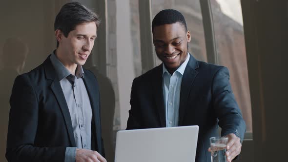 Two Multiracial Businessmen African American Architect and Caucasian Investor Engineer Showing in alt