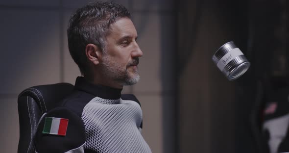 Astronaut Looking at Floating Tin Can alt