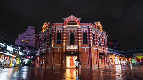 time lapse of The Red Chamber Theater or "The Red House Ximen" with falling rain in Ximending