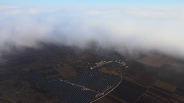 Aerial View of Big Sustainable Electric Power Plant with Many Rows of Solar Photovoltaic Panels for alt