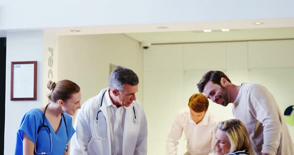 Doctors and patient interacting with each other alt