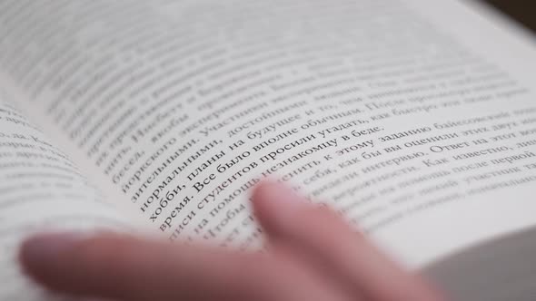 Turning Pages of a Book CloseUp Slow Motion alt