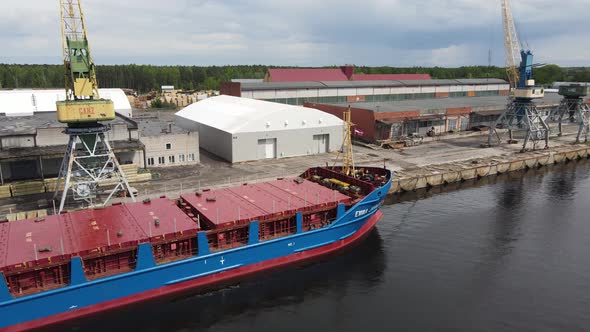 Cargo ship in port alt