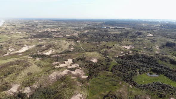 Coastal lowlands with small barren hills in Wijk aan Zee, North Holland, the Netherlands  alt