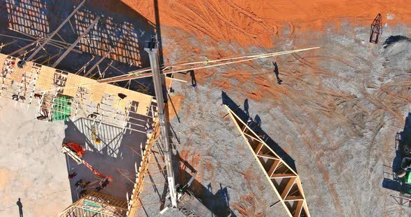 An Interior Viewed of Wooden Beams at Construction the Crane Holds Roof Truss System alt
