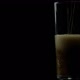 Cold Soda Drink Is Poured Into An Empty Glass On A Black Background - VideoHive Item for Sale
