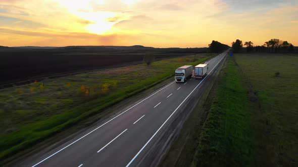 Aerial Drone View Semi Trucks Meeting on While Delivering Cargos By Road