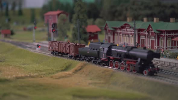 Mini Train Station Modelling. Model of Railway Station With Moving Train. Model Electric Locomotive alt