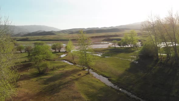 Drone Shot of River and Mountains in Kazakhstan alt