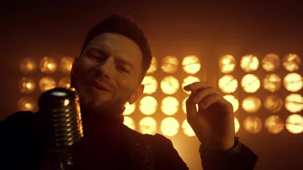 Handsome Man Singing Mic on Stage Close Up alt