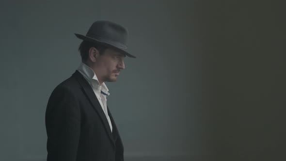 Portrait Confident Detective or Mafia Boss and Gangster Shooting with a Pistol alt