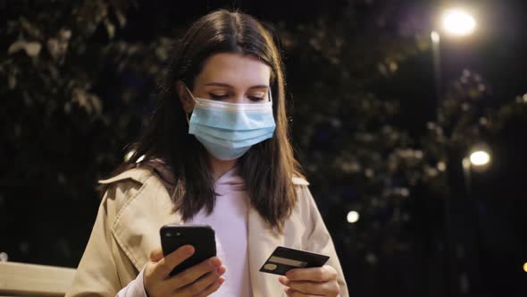 Woman Shopping Online with the Phone Application Using Credit Card alt