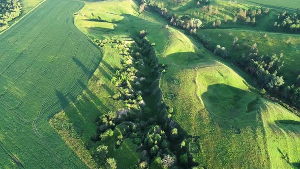 Aerial View of Beautiful Landscape with Hills and Green Field alt