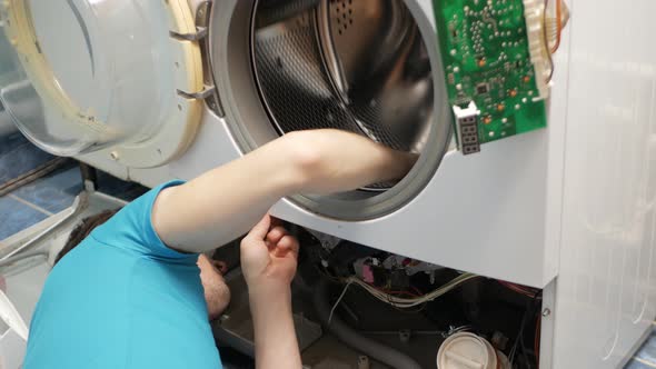 Man Fixes Washing Machine Repairs Broken Destroyed