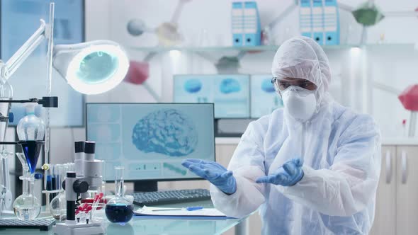 Professional Scientist Wearing AR Glasses in Modern High End Research Laboratory alt