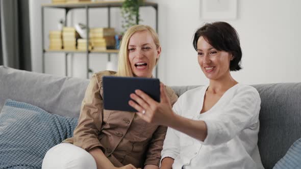 Women Using Tablet for Video Call