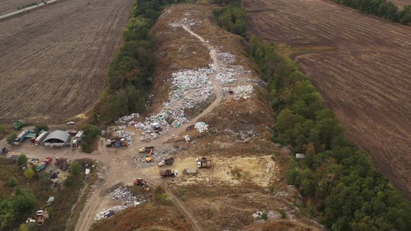 Waste Processing on a Rubbish Dump. Aerial View of Large Garbage Pile at Sorting Site. Packed Waste alt
