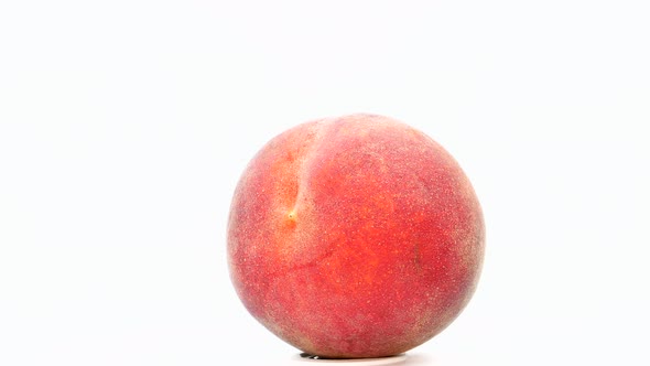 Red peach fruit on a white background. 