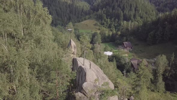 Stone rocks Ternoshorska Lada amidst beautiful scenic Carpathian forests, Ukraine