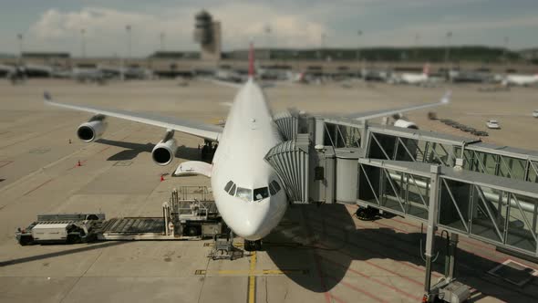 Commercial Airline Airplane Standing at Airport Terminal Gate alt