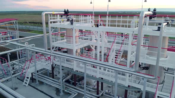 The Drone Flies Around Tanks for Collecting and Cleaning Gas From Oil in the Oil and Gas Industry alt