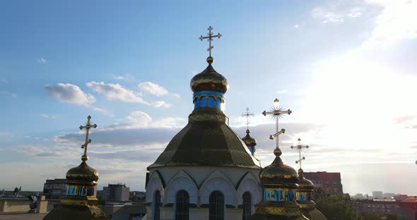The Golden Dome Of The Church With An Orthodox Cross Rises Above The City