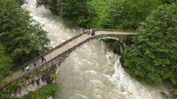 Stone Arch Bridge And People alt