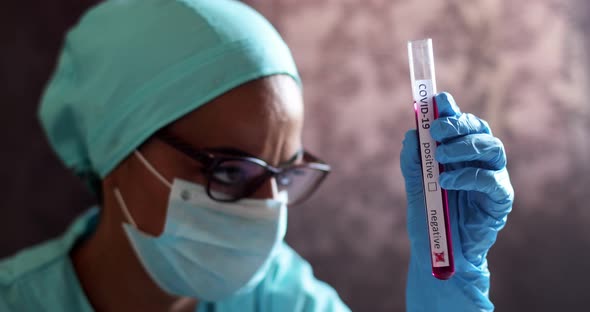 Doctor hands holding a coronavirus COVID-19 negative test tube