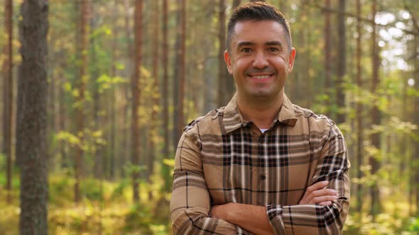 Happy Smiling Middle Aged Man in Forest alt