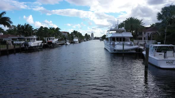Yachts mooring in waterway of Fort Lauderdale, Florida moderate tropical weather alt