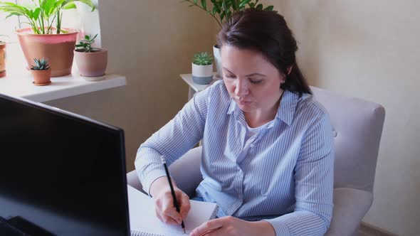 Middle Aged Woman in Casual Clothing Working From Home Remote Home Office