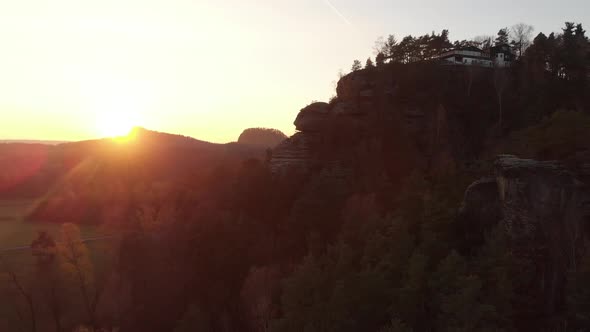 AERIAL: Sunset over beautiful landscape of Saxon Switzerland, Germany alt