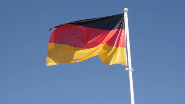 Famous  German flag on flag-pole floating in slow motion on wind 1080p HD footage - Recognizable  Ge alt