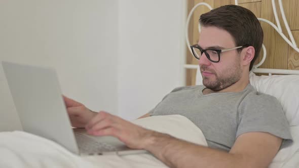 Beard Young Man Saying No with Head Sign in Bed alt